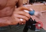 Image of Soldier cleaning his rifle during Operation Somerset Plain Vietnam, 1968, second 53 stock footage video 65675026843