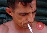 Image of Soldier cleaning his rifle during Operation Somerset Plain Vietnam, 1968, second 55 stock footage video 65675026843