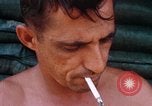 Image of Soldier cleaning his rifle during Operation Somerset Plain Vietnam, 1968, second 57 stock footage video 65675026843