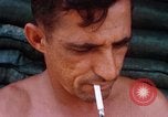 Image of Soldier cleaning his rifle during Operation Somerset Plain Vietnam, 1968, second 62 stock footage video 65675026843