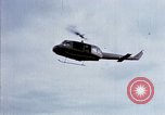 Image of Flying and landing of UH-1H helicopter during Operation Somerset Plain Vietnam, 1968, second 7 stock footage video 65675026846