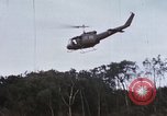 Image of Flying and landing of UH-1H helicopter during Operation Somerset Plain Vietnam, 1968, second 24 stock footage video 65675026846