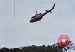 Image of Flying and landing of UH-1H helicopter during Operation Somerset Plain Vietnam, 1968, second 25 stock footage video 65675026846