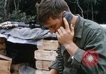 Image of US Soldier speaking on the phone during Operation Somerset Plain Vietnam, 1968, second 15 stock footage video 65675026848
