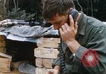 Image of US Soldier speaking on the phone during Operation Somerset Plain Vietnam, 1968, second 16 stock footage video 65675026848