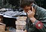 Image of US Soldier speaking on the phone during Operation Somerset Plain Vietnam, 1968, second 17 stock footage video 65675026848