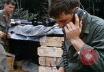 Image of US Soldier speaking on the phone during Operation Somerset Plain Vietnam, 1968, second 18 stock footage video 65675026848