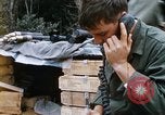 Image of US Soldier speaking on the phone during Operation Somerset Plain Vietnam, 1968, second 19 stock footage video 65675026848