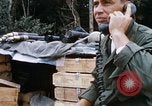 Image of US Soldier speaking on the phone during Operation Somerset Plain Vietnam, 1968, second 20 stock footage video 65675026848