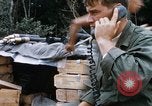 Image of US Soldier speaking on the phone during Operation Somerset Plain Vietnam, 1968, second 21 stock footage video 65675026848
