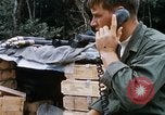 Image of US Soldier speaking on the phone during Operation Somerset Plain Vietnam, 1968, second 22 stock footage video 65675026848