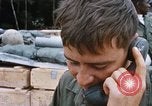 Image of US Soldier speaking on the phone during Operation Somerset Plain Vietnam, 1968, second 23 stock footage video 65675026848