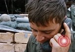 Image of US Soldier speaking on the phone during Operation Somerset Plain Vietnam, 1968, second 24 stock footage video 65675026848