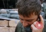 Image of US Soldier speaking on the phone during Operation Somerset Plain Vietnam, 1968, second 25 stock footage video 65675026848