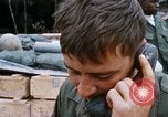 Image of US Soldier speaking on the phone during Operation Somerset Plain Vietnam, 1968, second 26 stock footage video 65675026848