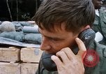 Image of US Soldier speaking on the phone during Operation Somerset Plain Vietnam, 1968, second 27 stock footage video 65675026848