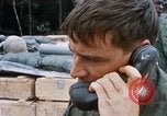 Image of US Soldier speaking on the phone during Operation Somerset Plain Vietnam, 1968, second 28 stock footage video 65675026848