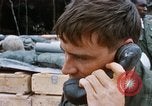 Image of US Soldier speaking on the phone during Operation Somerset Plain Vietnam, 1968, second 29 stock footage video 65675026848