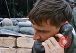 Image of US Soldier speaking on the phone during Operation Somerset Plain Vietnam, 1968, second 30 stock footage video 65675026848