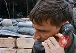 Image of US Soldier speaking on the phone during Operation Somerset Plain Vietnam, 1968, second 31 stock footage video 65675026848