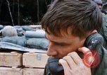 Image of US Soldier speaking on the phone during Operation Somerset Plain Vietnam, 1968, second 32 stock footage video 65675026848