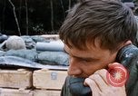 Image of US Soldier speaking on the phone during Operation Somerset Plain Vietnam, 1968, second 33 stock footage video 65675026848