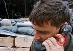Image of US Soldier speaking on the phone during Operation Somerset Plain Vietnam, 1968, second 34 stock footage video 65675026848