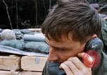 Image of US Soldier speaking on the phone during Operation Somerset Plain Vietnam, 1968, second 36 stock footage video 65675026848
