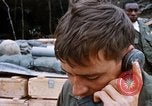 Image of US Soldier speaking on the phone during Operation Somerset Plain Vietnam, 1968, second 37 stock footage video 65675026848