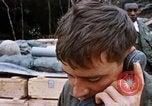Image of US Soldier speaking on the phone during Operation Somerset Plain Vietnam, 1968, second 38 stock footage video 65675026848