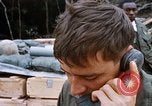 Image of US Soldier speaking on the phone during Operation Somerset Plain Vietnam, 1968, second 41 stock footage video 65675026848