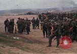 Image of Soldiers landing at Camp Evans from UH-1D helicopter A Shau Valley Vietnam, 1968, second 15 stock footage video 65675026856