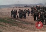 Image of Soldiers landing at Camp Evans from UH-1D helicopter A Shau Valley Vietnam, 1968, second 16 stock footage video 65675026856