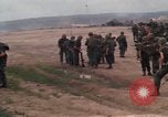 Image of Soldiers landing at Camp Evans from UH-1D helicopter A Shau Valley Vietnam, 1968, second 17 stock footage video 65675026856