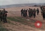 Image of Soldiers landing at Camp Evans from UH-1D helicopter A Shau Valley Vietnam, 1968, second 18 stock footage video 65675026856