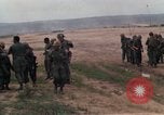 Image of Soldiers landing at Camp Evans from UH-1D helicopter A Shau Valley Vietnam, 1968, second 20 stock footage video 65675026856