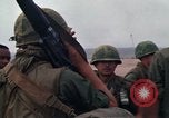 Image of Soldiers landing at Camp Evans from UH-1D helicopter A Shau Valley Vietnam, 1968, second 27 stock footage video 65675026856