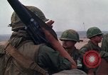 Image of Soldiers landing at Camp Evans from UH-1D helicopter A Shau Valley Vietnam, 1968, second 28 stock footage video 65675026856