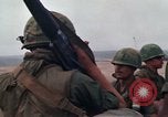 Image of Soldiers landing at Camp Evans from UH-1D helicopter A Shau Valley Vietnam, 1968, second 29 stock footage video 65675026856