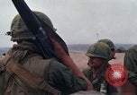 Image of Soldiers landing at Camp Evans from UH-1D helicopter A Shau Valley Vietnam, 1968, second 31 stock footage video 65675026856