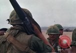 Image of Soldiers landing at Camp Evans from UH-1D helicopter A Shau Valley Vietnam, 1968, second 33 stock footage video 65675026856