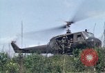 Image of Soldiers landing at Camp Evans from UH-1D helicopter A Shau Valley Vietnam, 1968, second 36 stock footage video 65675026856