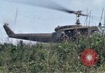 Image of Soldiers landing at Camp Evans from UH-1D helicopter A Shau Valley Vietnam, 1968, second 39 stock footage video 65675026856