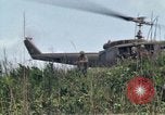 Image of Soldiers landing at Camp Evans from UH-1D helicopter A Shau Valley Vietnam, 1968, second 40 stock footage video 65675026856