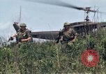 Image of Soldiers landing at Camp Evans from UH-1D helicopter A Shau Valley Vietnam, 1968, second 45 stock footage video 65675026856