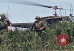 Image of Soldiers landing at Camp Evans from UH-1D helicopter A Shau Valley Vietnam, 1968, second 46 stock footage video 65675026856