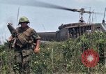 Image of Soldiers landing at Camp Evans from UH-1D helicopter A Shau Valley Vietnam, 1968, second 48 stock footage video 65675026856