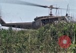 Image of Soldiers landing at Camp Evans from UH-1D helicopter A Shau Valley Vietnam, 1968, second 50 stock footage video 65675026856