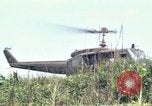 Image of Soldiers landing at Camp Evans from UH-1D helicopter A Shau Valley Vietnam, 1968, second 52 stock footage video 65675026856