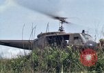 Image of Soldiers landing at Camp Evans from UH-1D helicopter A Shau Valley Vietnam, 1968, second 54 stock footage video 65675026856